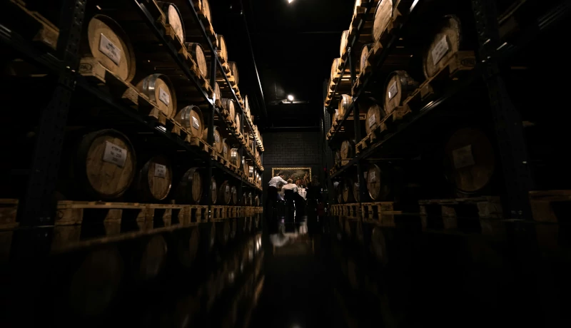 The aging process of spirits like whiskey and rum